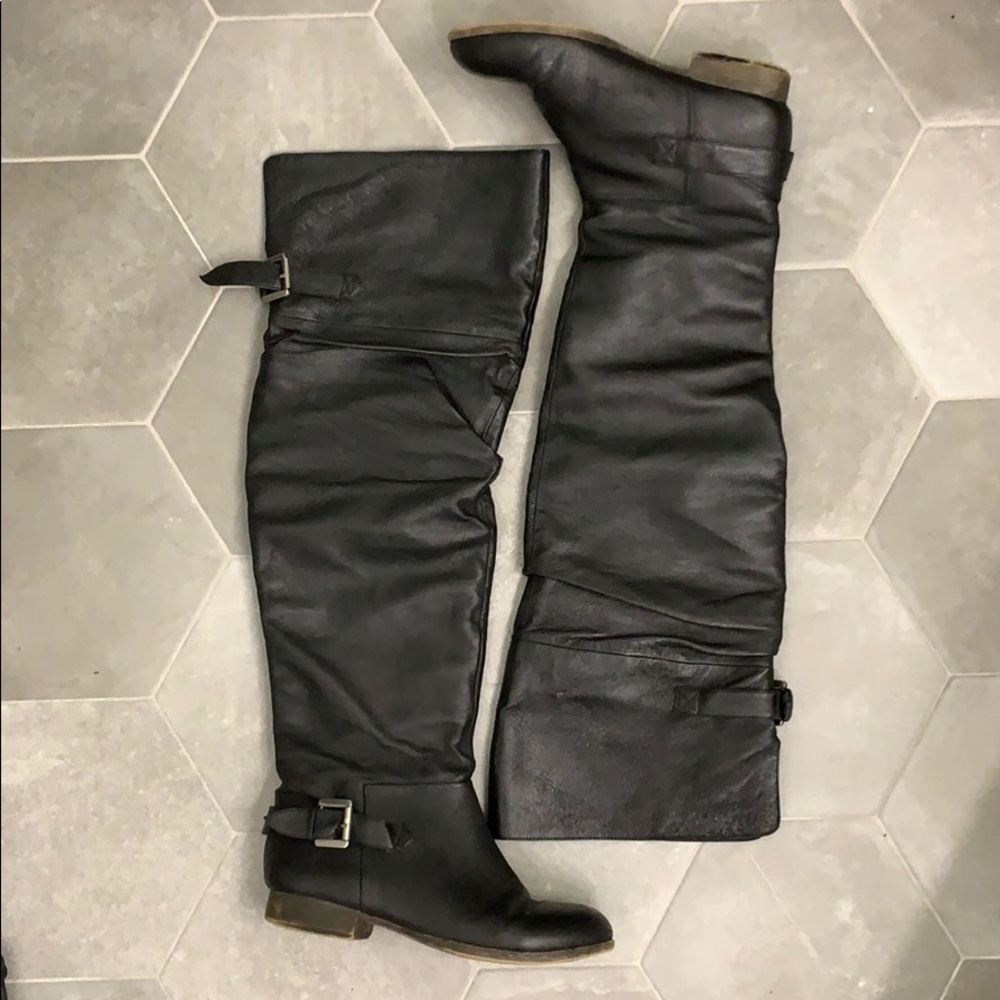 Black over-the-knee boots with buckle detail